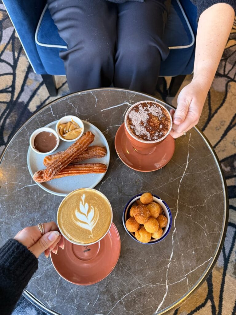 Coffee and snacks on table